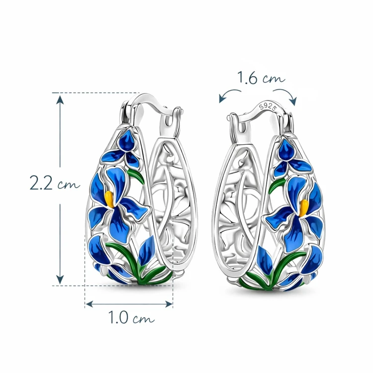 Srebrne kolczyki koła 22 × 10 mm z kwiatowym zdobieniem – widok na jasnym tle